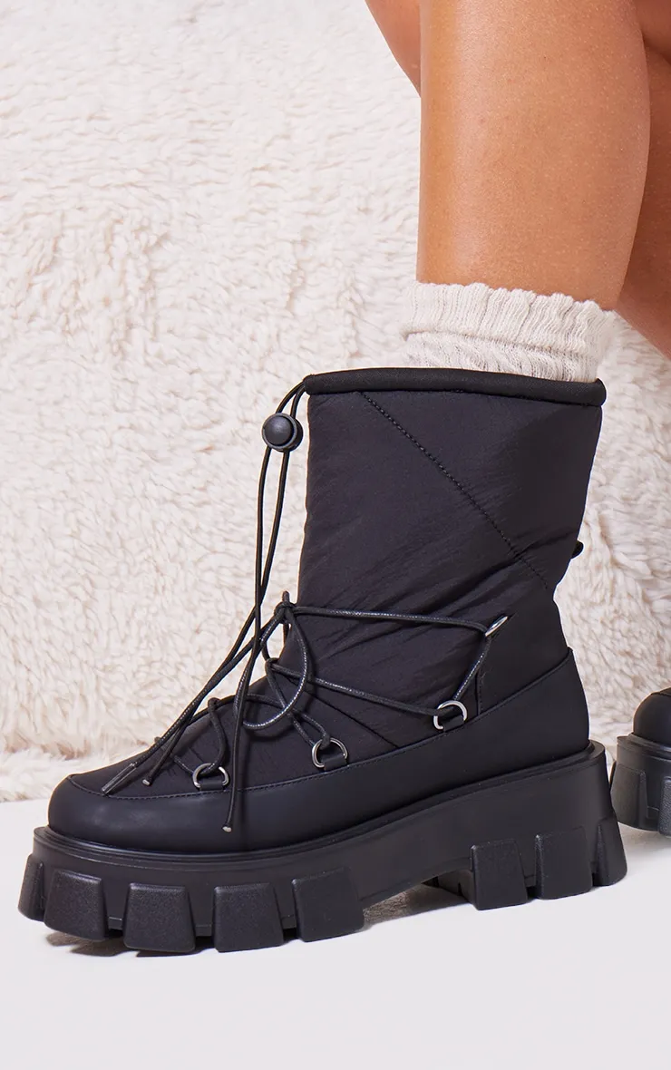 Bottes de neige rondes chunky noires matelassées à plateformes et lacets