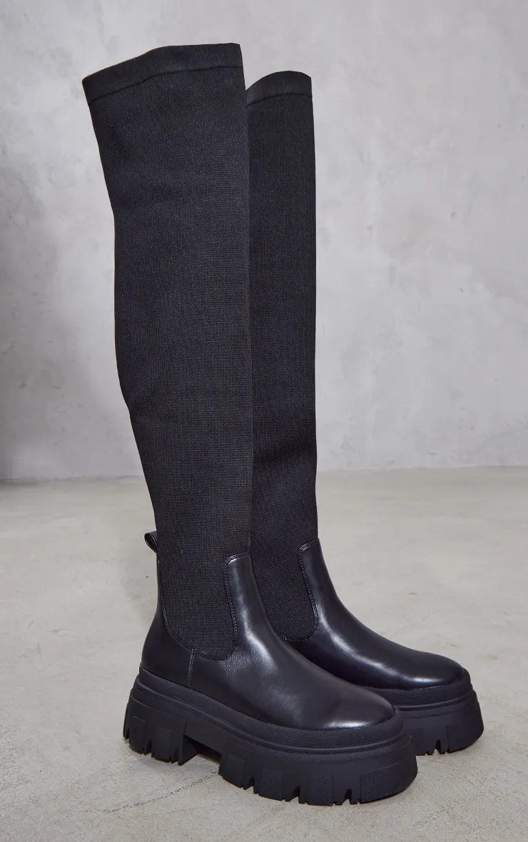 Bottes hautes noires en PU texturé à semelle très crantée et parties en maille contrastantes