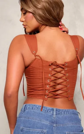 Corset structuré rouille avec lacets à l'arrière et bretelles nouées