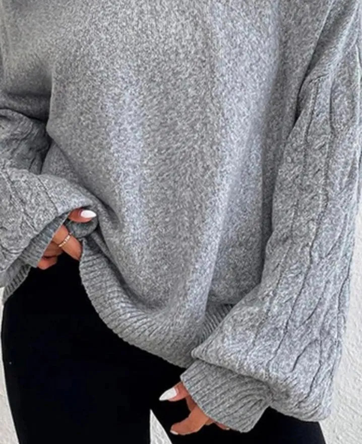 Pull à épaules dénudées et manches lanterne en tricot torsadé